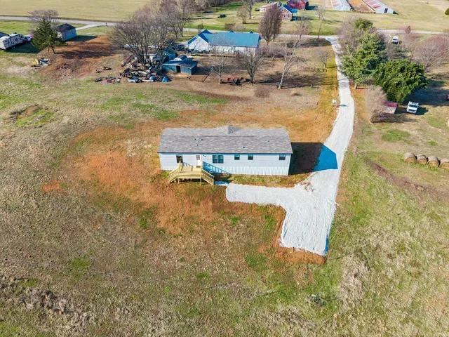 a view of a lake with houses in the back