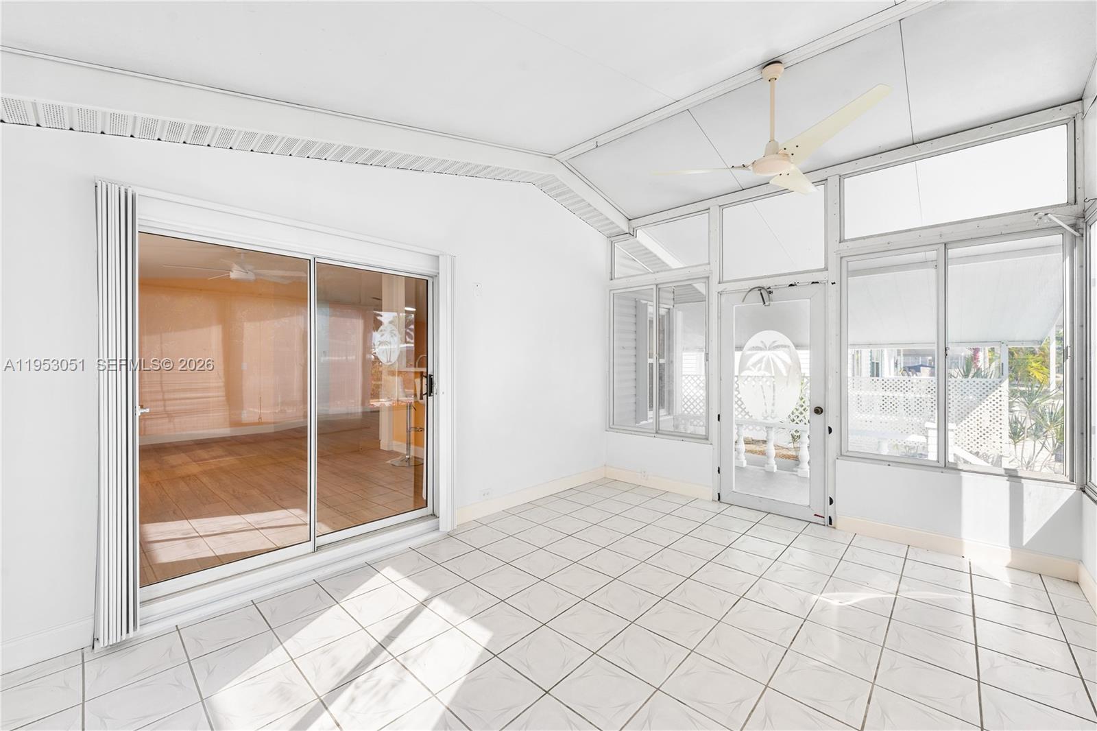 5611 Southwest 32nd Terrace Dania Beach, FL 33312 - Photo 11 of 29 a spacious bedroom with a bed and a shower