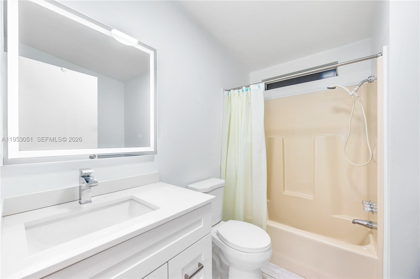 5611 Southwest 32nd Terrace Dania Beach, FL 33312 - Photo 14 of 29 a bathroom with a sink and a mirror