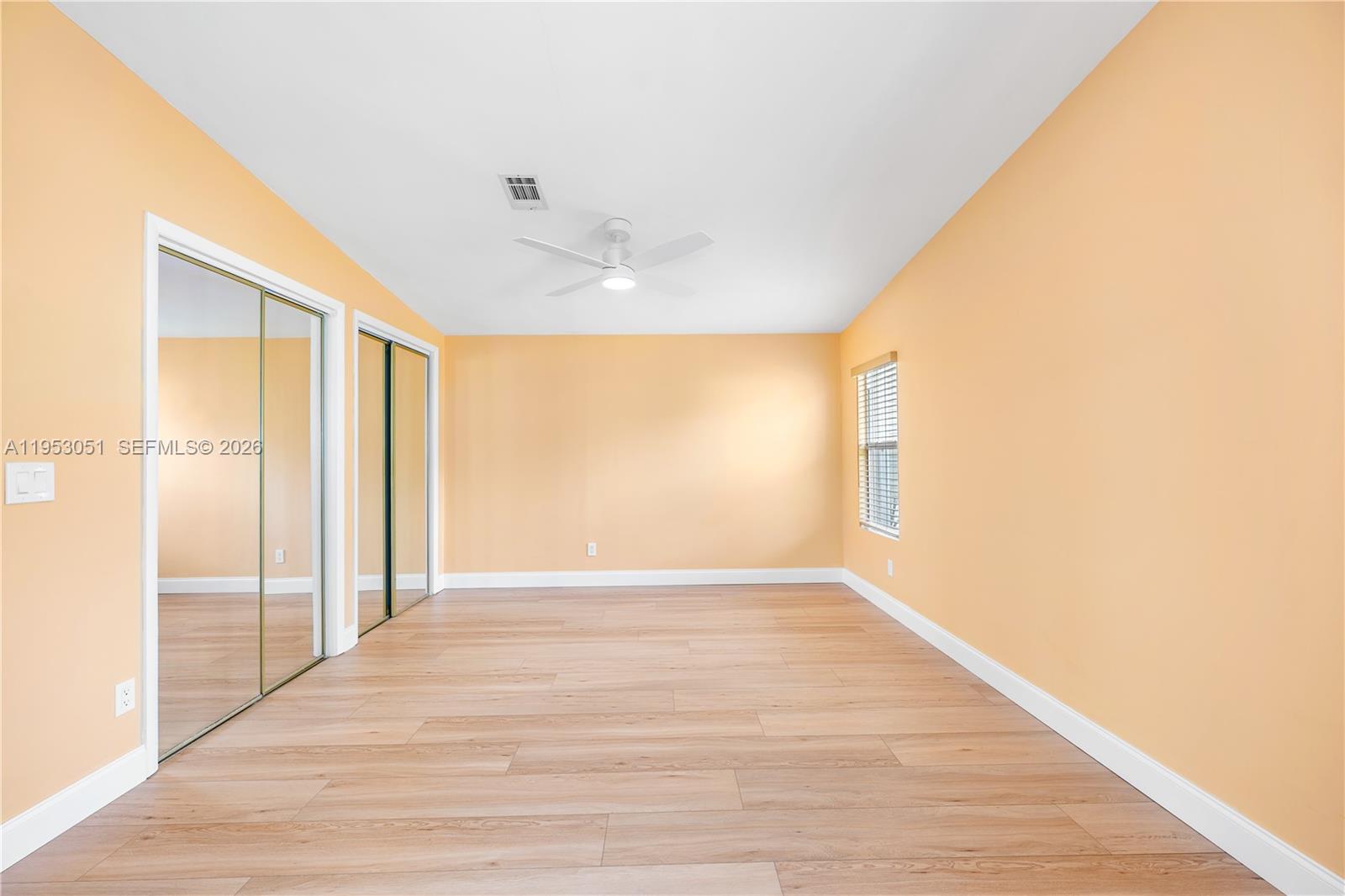 5611 Southwest 32nd Terrace Dania Beach, FL 33312 - Photo 16 of 29 a view of an empty room with wooden floor and a window