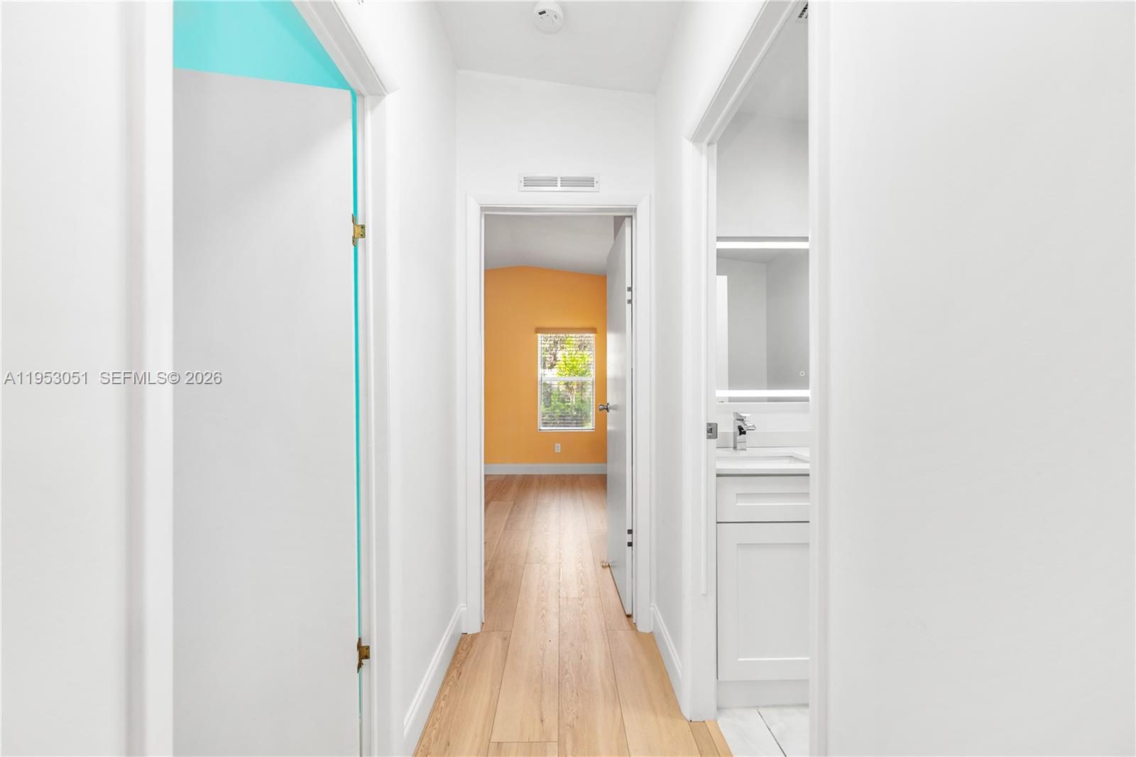 5611 Southwest 32nd Terrace Dania Beach, FL 33312 - Photo 21 of 29 a view of a hallway with wooden floor
