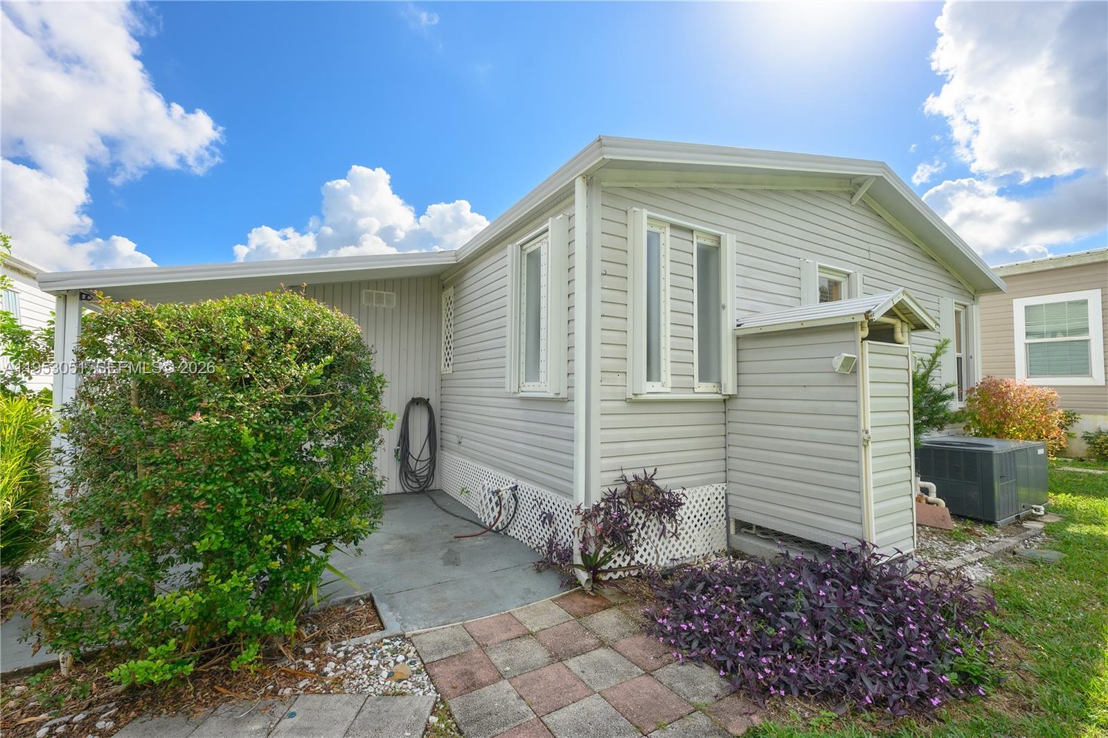 5611 Southwest 32nd Terrace Dania Beach, FL 33312 - Photo 26 of 29 a front view of a house with garden