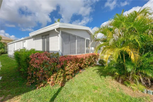 a view of a house with a garden