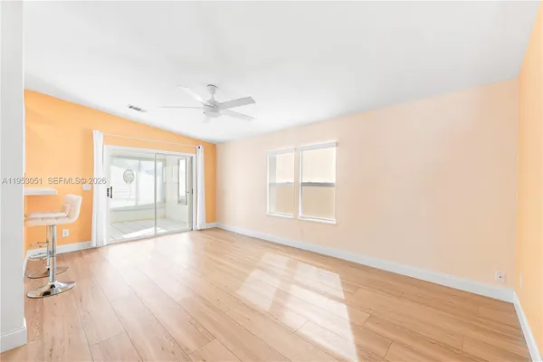 a view of an empty room with a window