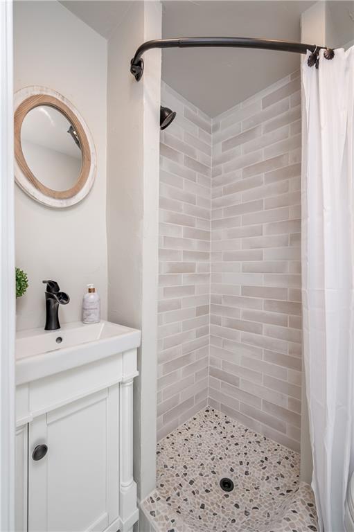 146 Shannon Road Renfrew, PA 16053 - Photo 17 of 25 a bathroom with a sink a mirror and a shower