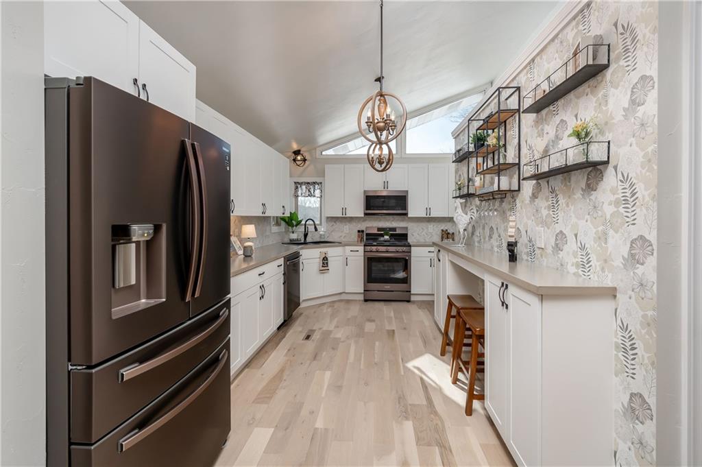 146 Shannon Road Renfrew, PA 16053 - Photo 6 of 25 a kitchen with stainless steel appliances granite countertop a refrigerator a stove and a refrigerator