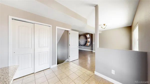 a view of a hallway and wooden floor
