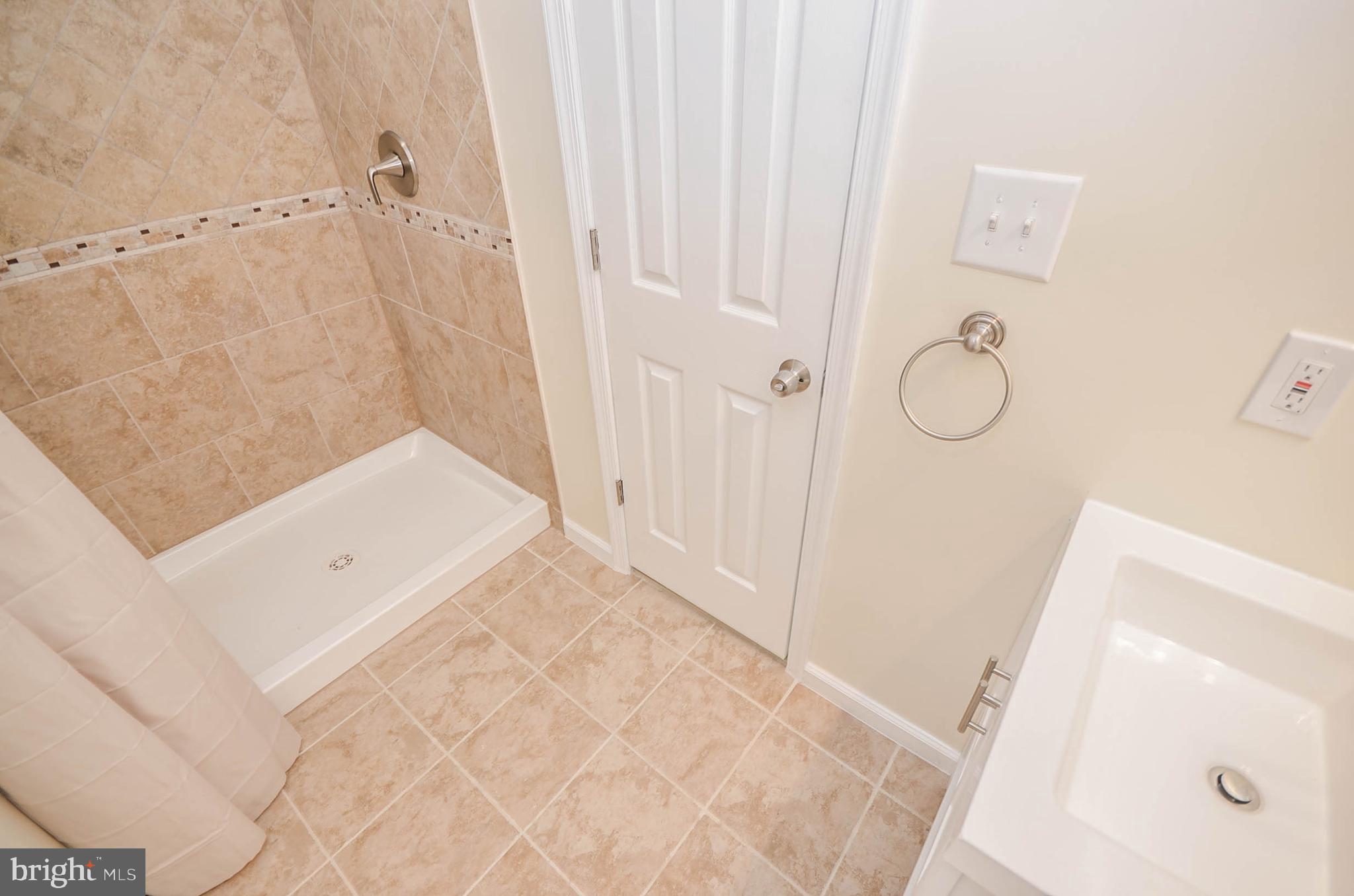 19 Sonata Court Silver Spring, MD 20901 - Photo 24 of 32 Lower level bath is brand new with permits!