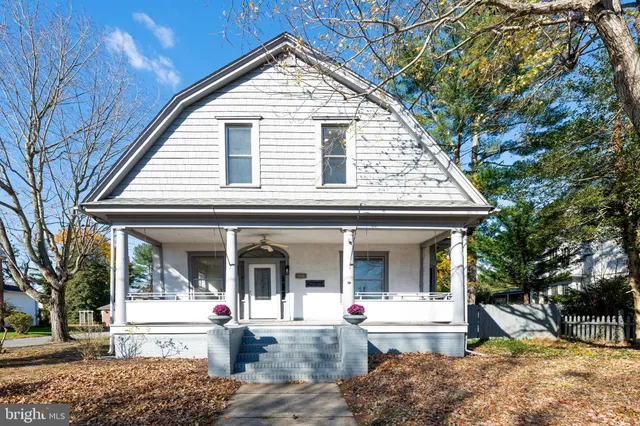 a front view of a house with a porch