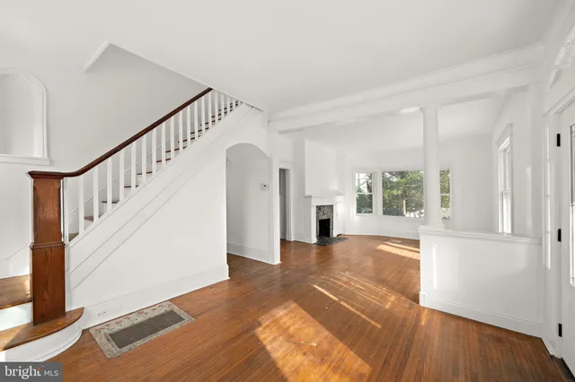 a view of an entryway with wooden floor