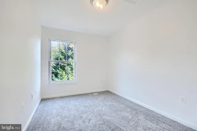 an empty room with closet area