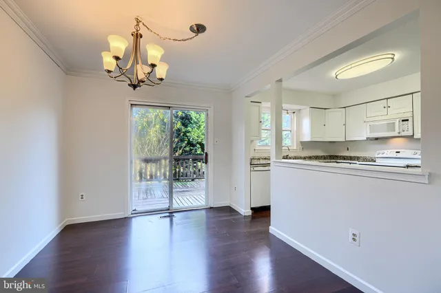 a view of a kitchen with a dishwasher cabinets and wooden floor