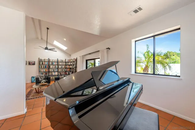 a bathroom with a sink a mirror and a shower