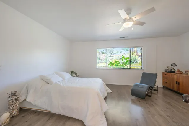 a view of a terrace with furniture and a garden