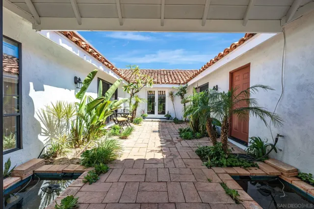 a bathroom with a sink a large mirror and a bathtub with mirror
