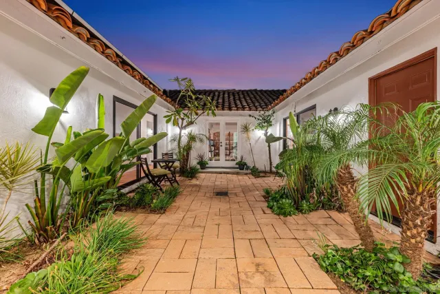 a view of a dining room with furniture and window