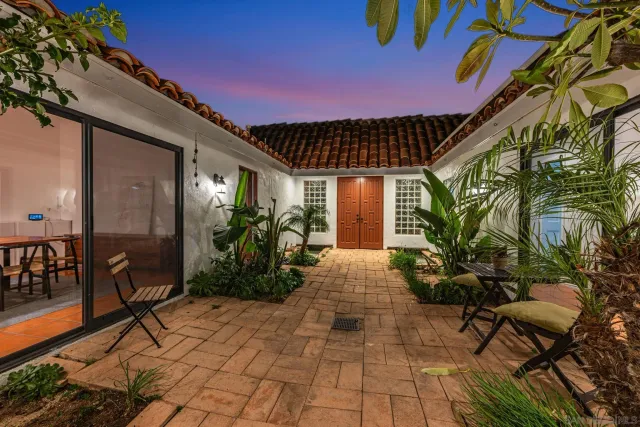 a view of a swimming pool with an outdoor space and seating area