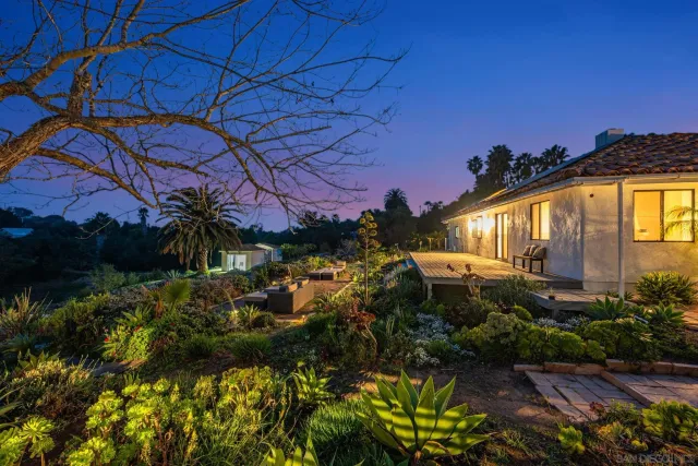 a picture of palm trees in front of a house