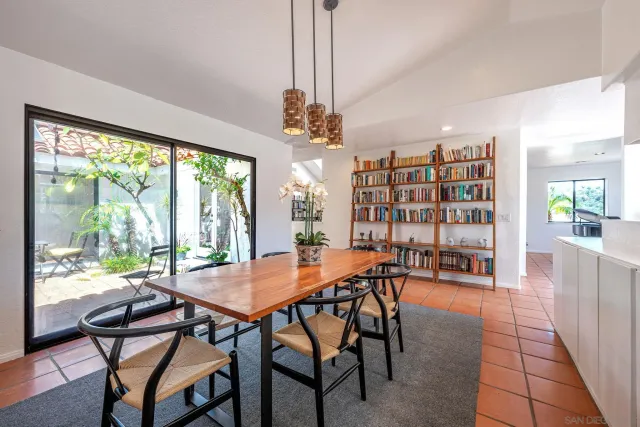 a large kitchen with stainless steel appliances granite countertop a lot of counter space
