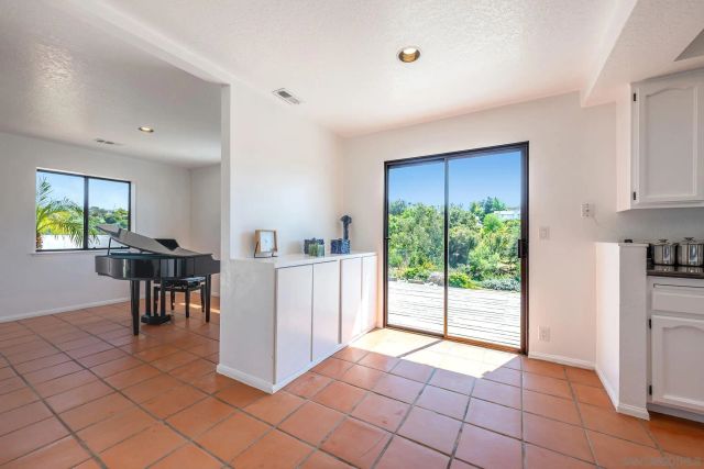 a backyard of a house with a yard and outdoor seating