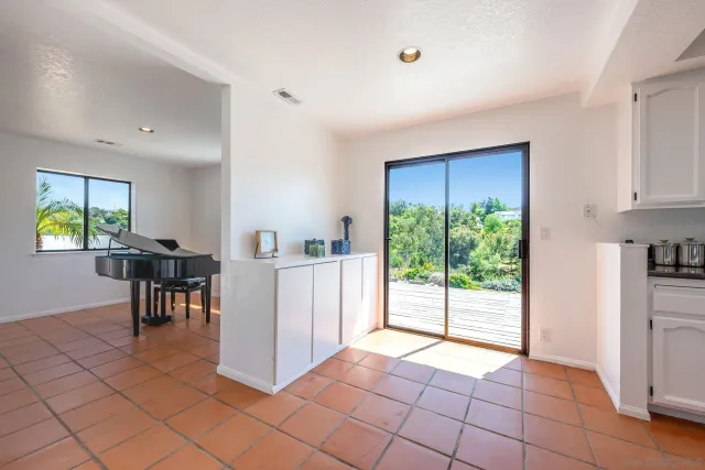 a backyard of a house with a yard and outdoor seating