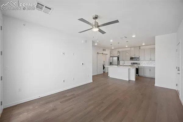 a view of kitchen view with wooden floor and window