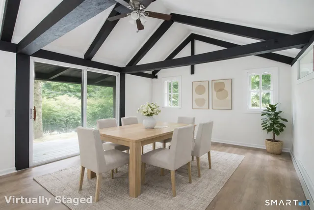 a dining room with furniture and window