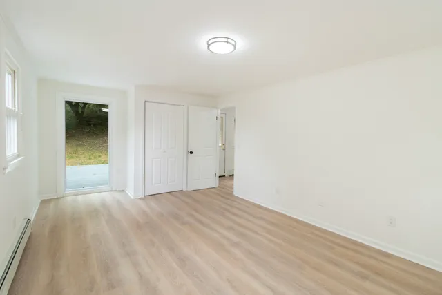 a view of an empty room and window