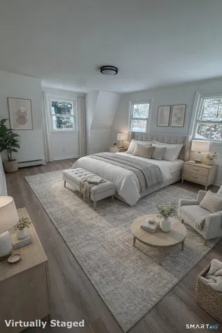 a bedroom with bed and window