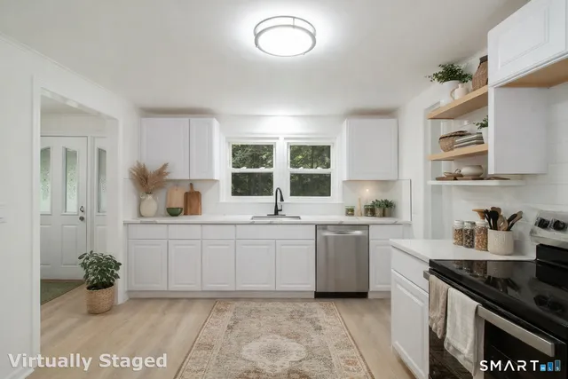 a kitchen with sink cabinets and window