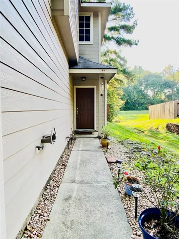 a view of a backyard with sitting area