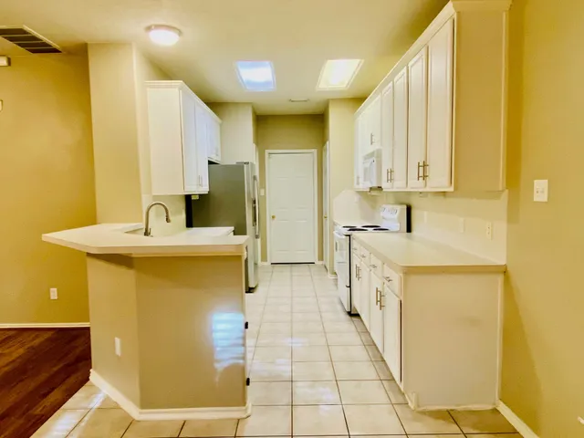 a bathroom with a sink a mirror and a toilet