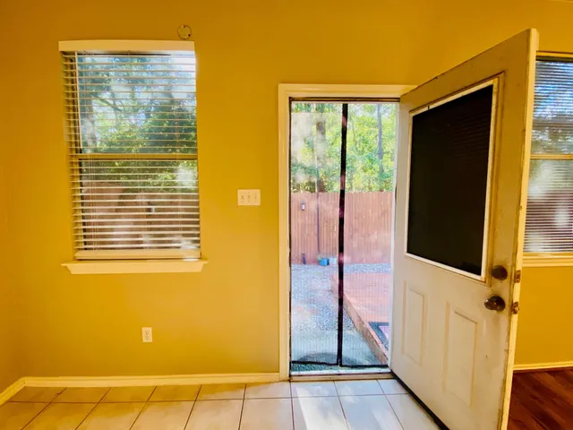 a view of a bathroom with a glass door