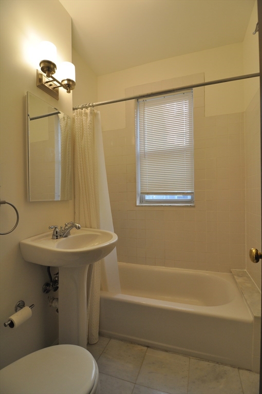 131 Park Drive, Unit 11 Boston, MA 02215 - Photo 3 of 15 a bathroom with a sink a toilet and shower