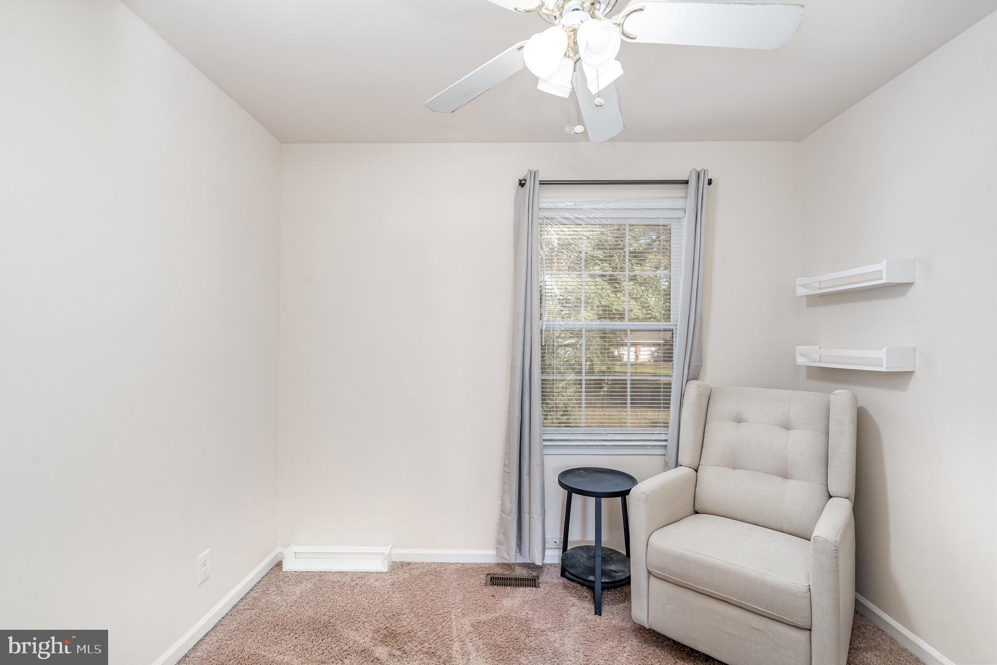 205 Powhatan Court, Unit 100 Stafford, VA 22556 - Photo 15 of 23 a living room with furniture and a window
