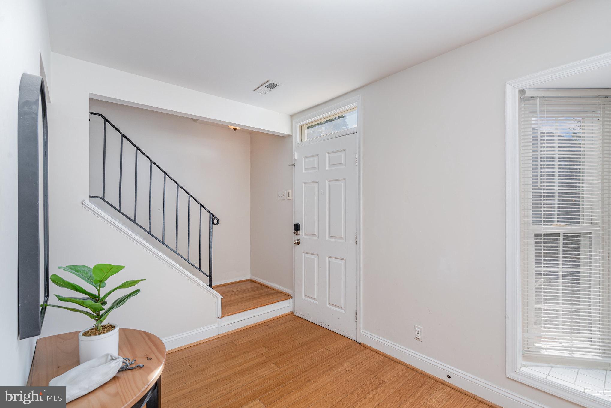 205 Powhatan Court, Unit 100 Stafford, VA 22556 - Photo 2 of 23 a view of entryway with wooden floor