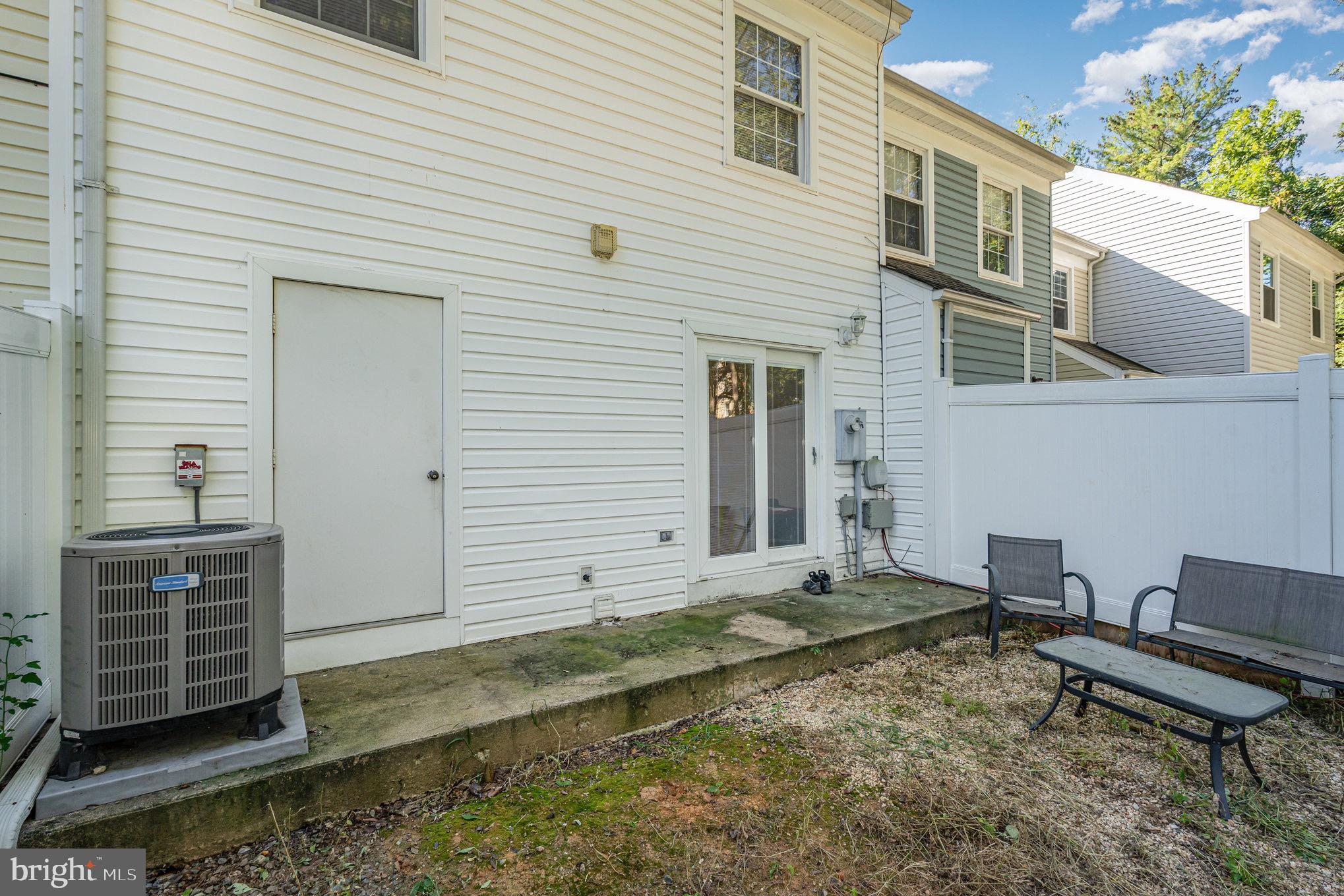 205 Powhatan Court, Unit 100 Stafford, VA 22556 - Photo 22 of 23 a backyard of a house