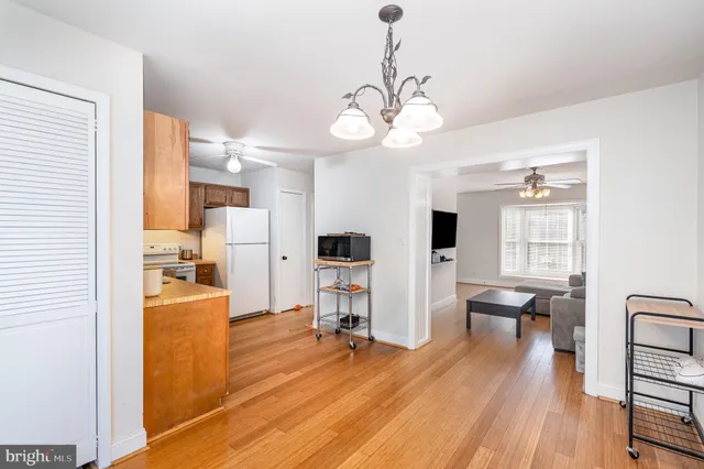 a view of a livingroom with furniture and a wooden floor