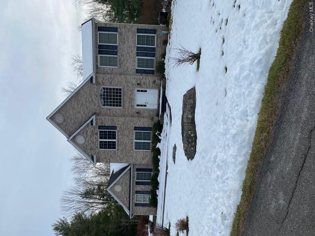 Lot 114 Old Congress Road Monticello, NY 12701 - Photo 4 of 10 a front view of a house with a yard