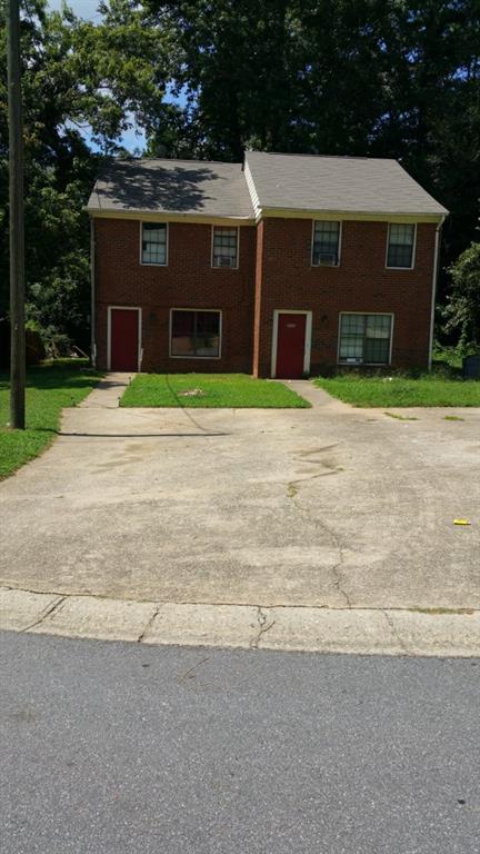 4236 Dejohns Way Buford, GA 30518 - Photo 1 of 1 a front view of a house with a yard and garage