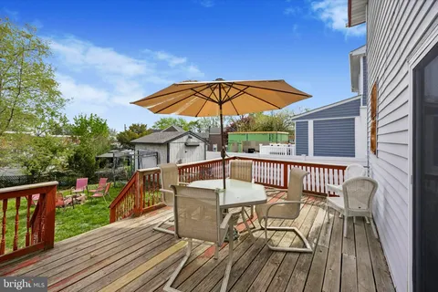 a view of balcony with outdoor seating and wooden floor