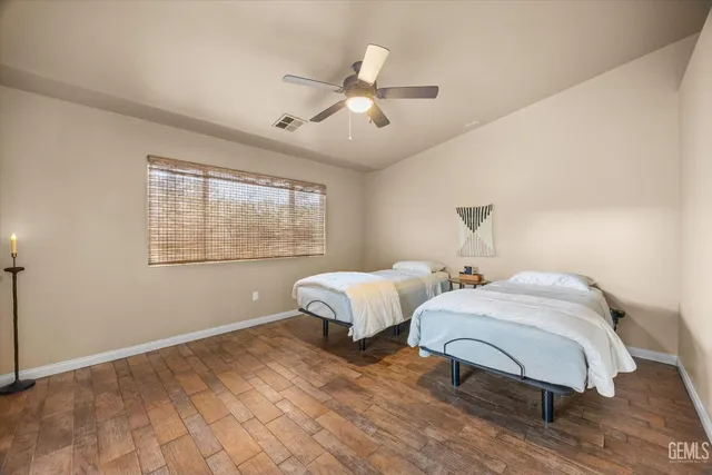 a bathroom with a double vanity sink and mirror
