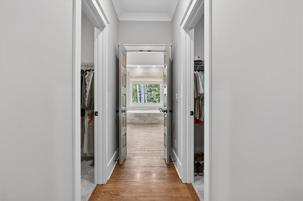 122 Brookfield Court White, GA 30184 - Photo 27 of 63 a view of a hallway with wooden floor and a bathroom