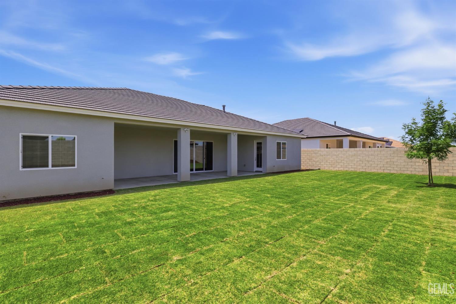 Undisclosed Address Bakersfield, CA 93314 - Photo 54 of 55 a view of a house with a backyard