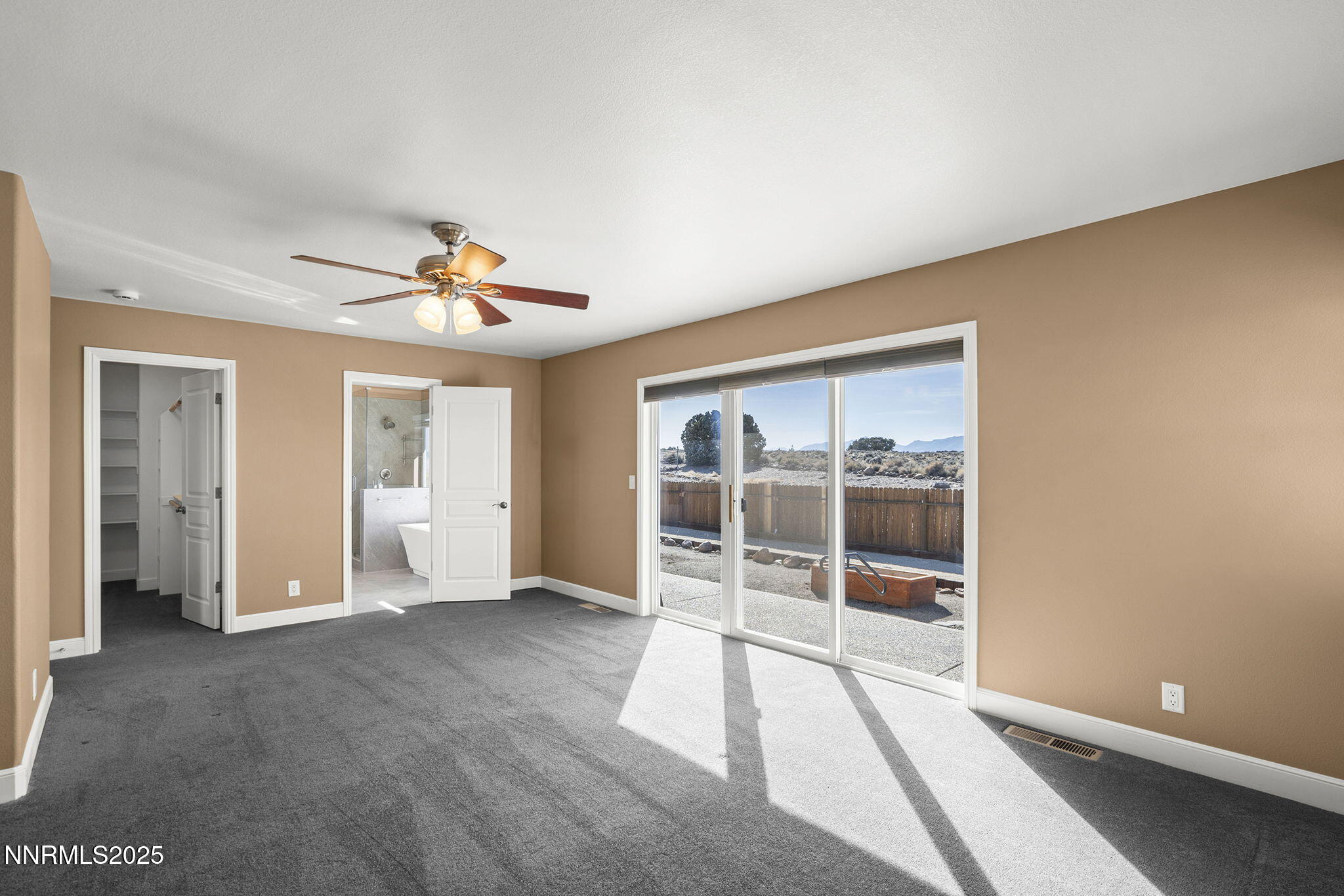 1100 Out-R-Way Gardnerville, NV 89410 - Photo 11 of 30 a view of empty room with wooden floor and fan