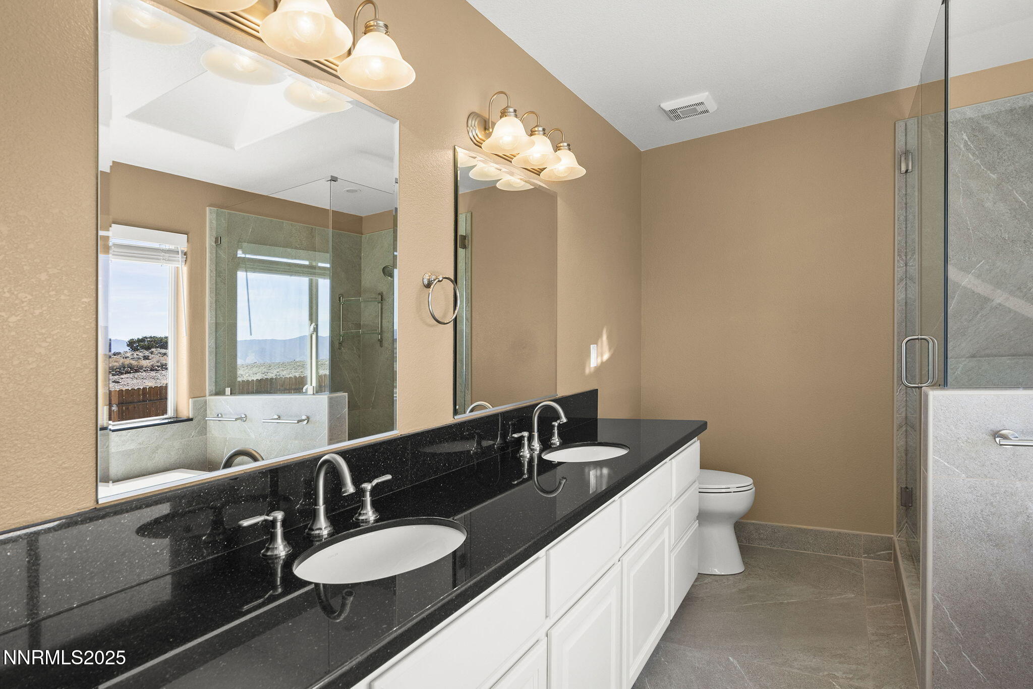 1100 Out-R-Way Gardnerville, NV 89410 - Photo 13 of 30 a bathroom with a double vanity sink a mirror and a shower