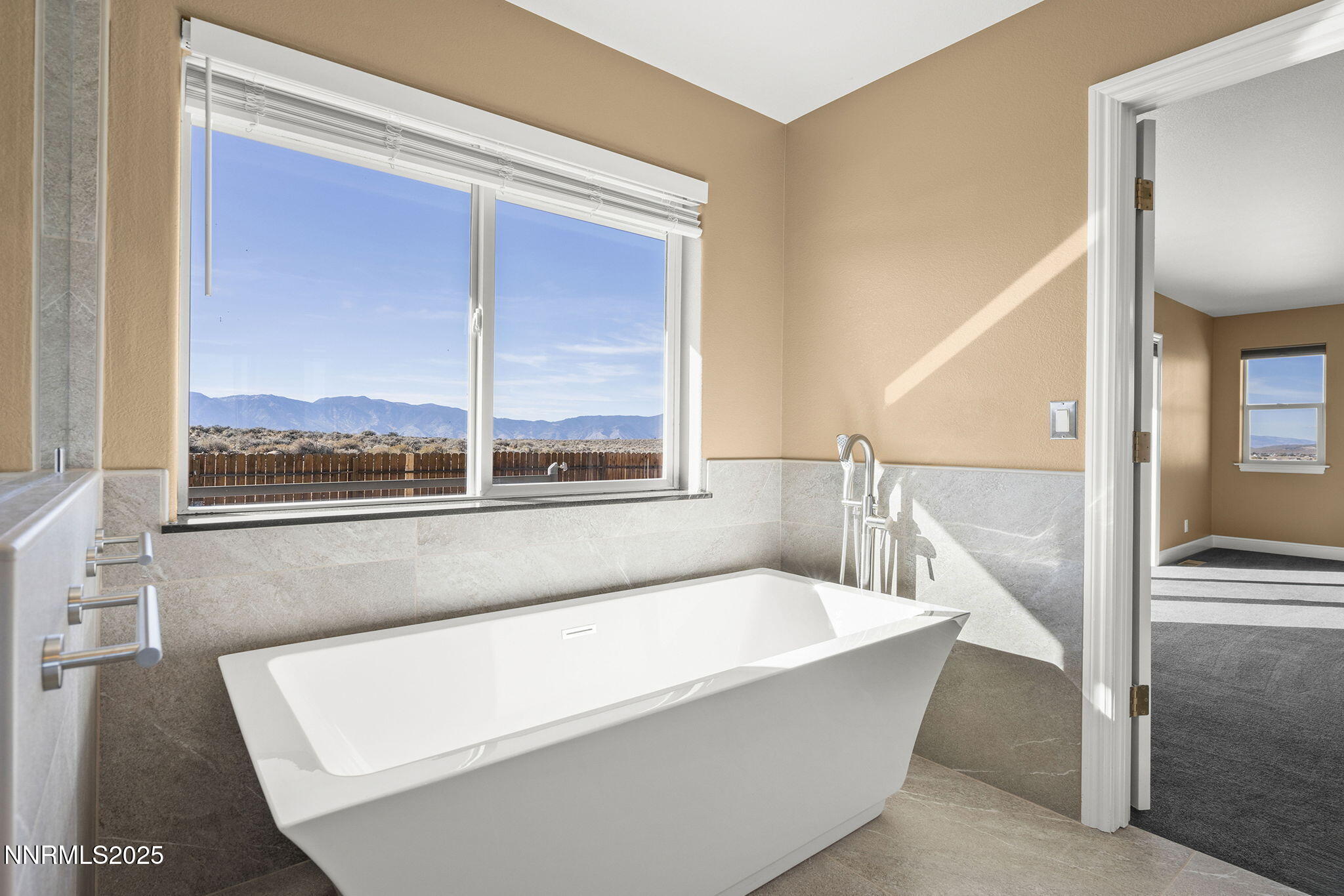 1100 Out-R-Way Gardnerville, NV 89410 - Photo 14 of 30 a bathroom with a bathtub and next to a window