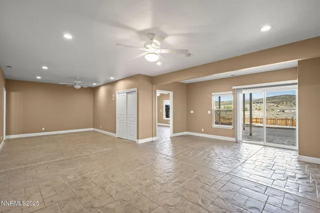 a view of an empty room with glass door