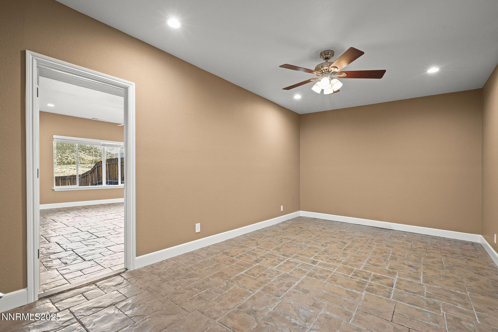 1100 Out-R-Way Gardnerville, NV 89410 - Photo 22 of 30 an empty room with windows and fan