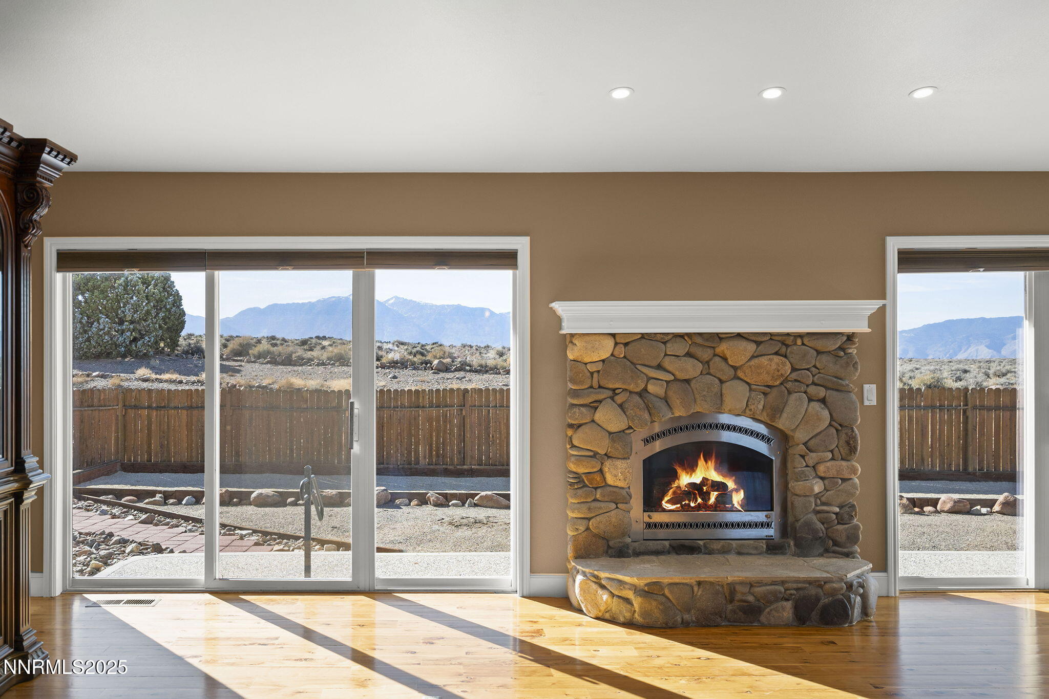 1100 Out-R-Way Gardnerville, NV 89410 - Photo 6 of 30 a living room with a fireplace and a floor to ceiling window